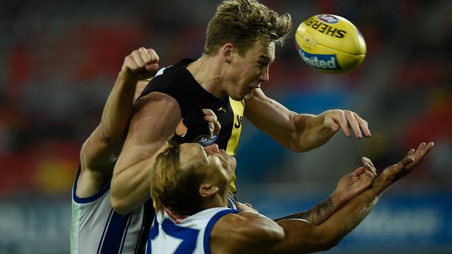 Kyron Hayden showed his courage when he was flattened in this marking contest. Picture: Getty Images