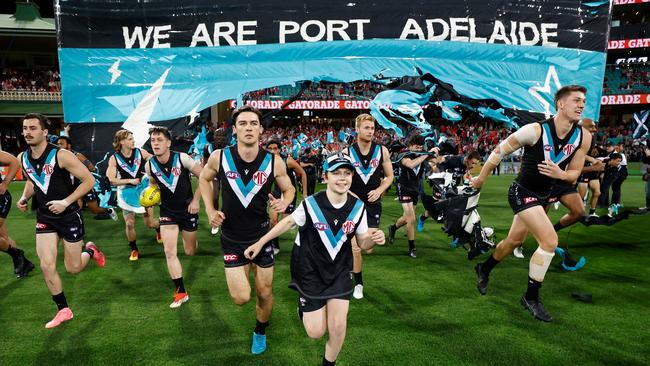 The Power run through their banner during the 2024 AFL First Preliminary Final match against the Sydney Swans at The Sydney Cricket Ground on September 20, 2024. Picture: Michael Willson/AFL Photos via Getty Images.