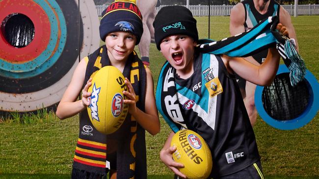 Young mates Tommy, 9, and Zac, 9, channel their AFL heroes at AFL Max. Picture: AAP/Mark Brake