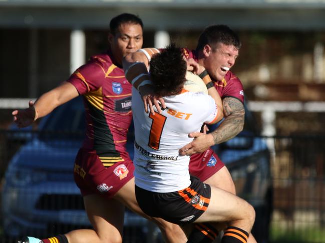 Daniel Payne is crunched by the Thirlmere defence. Picture Warren Gannon Photography