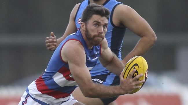 SANFL: Sturt v Central District at Unley Oval. Central's Isaya McKenzie breaks away with the ball. 2 June 2019. (AAP Image/Dean Martin)