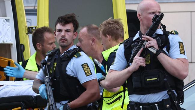 An ambulance and armed police are seen during the evacuation of people after a shooting in Copenhagen, Denmark. Picture: Olafur Steinar Gestsson/Ritzau Scanpix/AFP