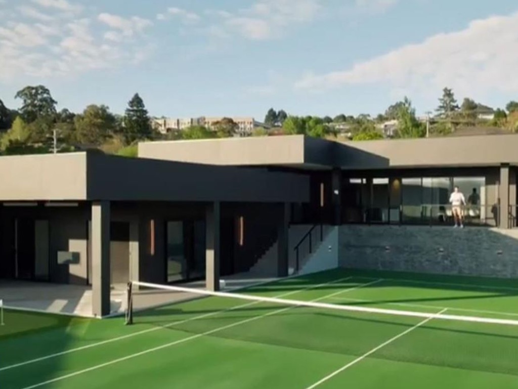 The all-black mansion is fit with a large tennis court.