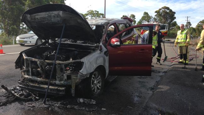 The aftermath ... Emergency crews inspect the damage after the new SUV caught fire. Picture: Supplied