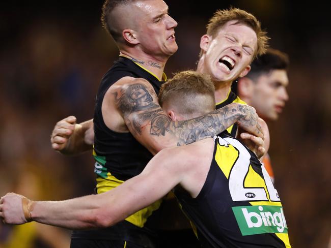 Richmond's Dustin Martin celebrates a third quarter goal with Richmond’s Josh Caddy and Jack Riewoldt. Picture: Michael Klein