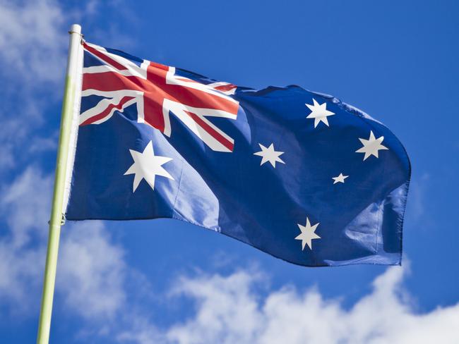 Close up image of an Australian flag billowing in the wind