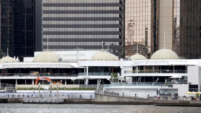 March 2023: Workers on site during the demolition of Eagle Street Pier. Picture: Steve Pohlner