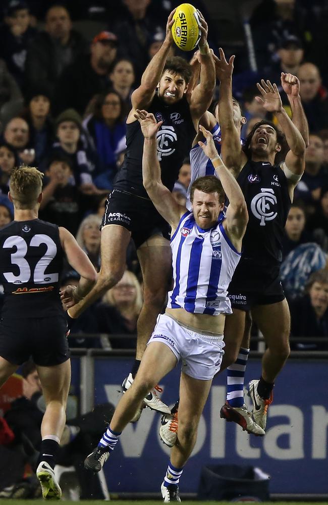 Jarrad Waite marks strongly over Kangaroo Lachie Hansen. Picture: Getty