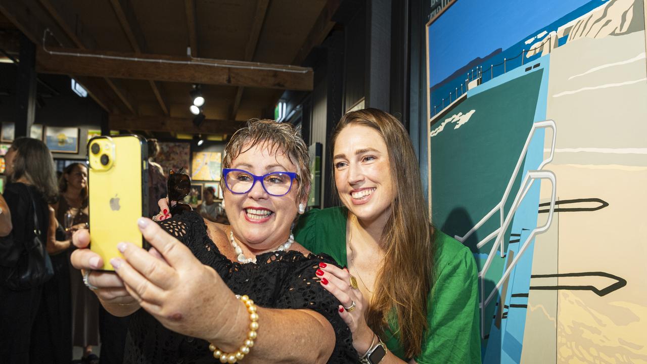 Annie Moorhouse takes a selfie with The Next Big Thing finalist Lydia Hicks after buying Lydia's Ocean Pool, Palm Beach at The Toowoomba Gallery, Friday, March 1, 2024. Picture: Kevin Farmer