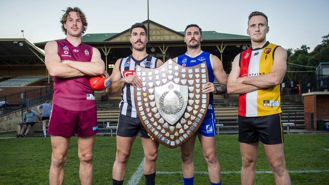 Lochie Charlton (PAOC), Jon Giannini (PNU), Jesse O'Brien (SPOC) and Lou Whitlelock (Goodwood) with the division one Premiership Shield at Thebarton Oval ahead of this Saturday’s preliminary finals. Picture: Mark Brake