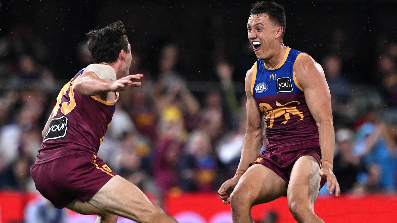 Noah Answerth (left) and Hugh McCluggage celebrate during the Lions’ comeback. (Photo by Bradley Kanaris/Getty Images)