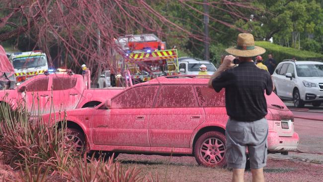 Fire retardant covering vehicles in Turramurra, in Sydney. Picture: John Grainger