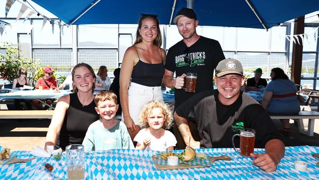 Jamie Weeks, Tyler Saggus, Claire Graham, Tatum Mozeley, 6, Millie Mozeley, 3, and Zac Mozeley celebrate Oktoberfest at Hemmingway's Brewery. Picture: Brendan Radke