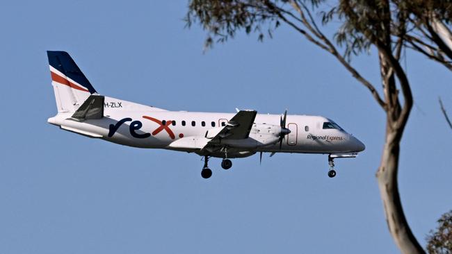 A Rex Saab 340 over Melbourne Airport. Picture: William West/AFP