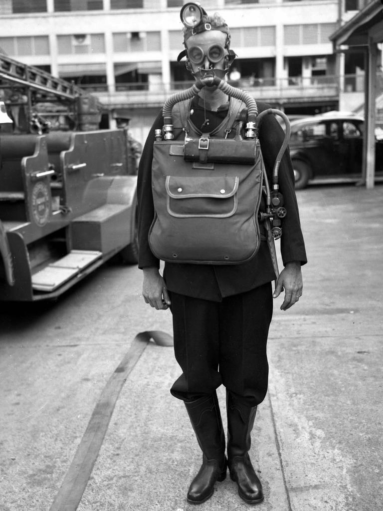 A fireman wears the latest rebreathing gear in 1950 at the Metropolitan Fire Brigade HQ.