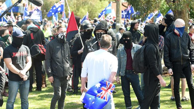 Protesters from one group surround an opponent. Picture: Mike Keating