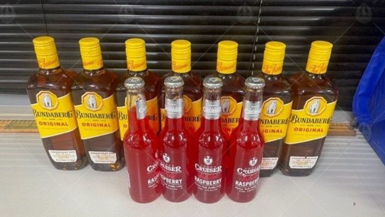 The alcohol NT Police seized in Wadeye included seven bottles of rum and four Cruisers. Picture: NT Police