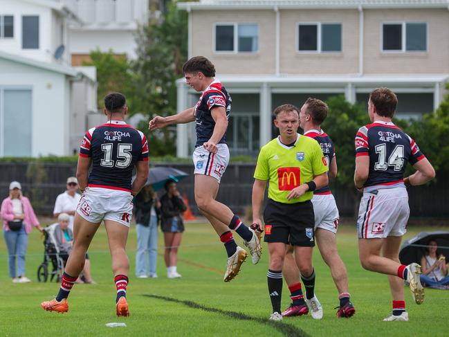 Michael Nassar jumps in to celebrate the Kynan Toeva try. Picture: Adam Wrightson Photography