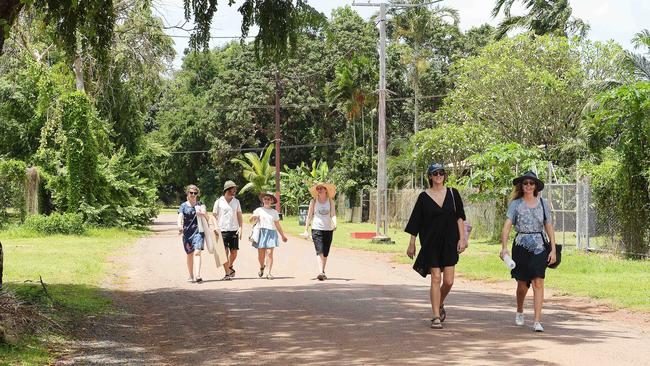 People are seen walking through Tiwi Island Picture: Keri Megelus