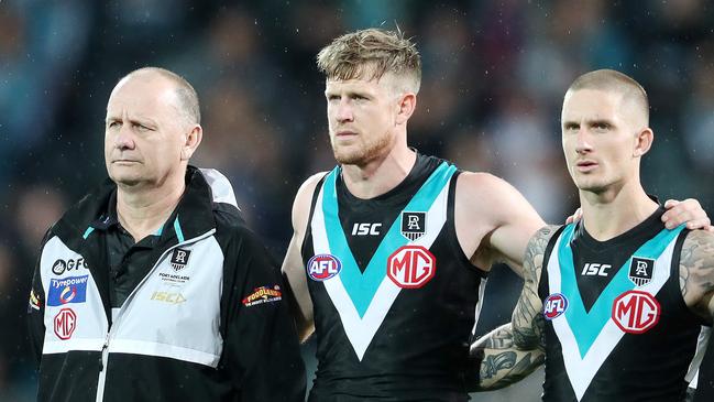 AFL - Friday, 16th October, 2020 - Preliminary Final - Port Adelaide v Richmond at the Adelaide Oval. Port Adelaide coach Ken Hinkley stands with his captain Tom Jonas and deputy Hamish Hartlett during the national anthem Picture: Sarah Reed