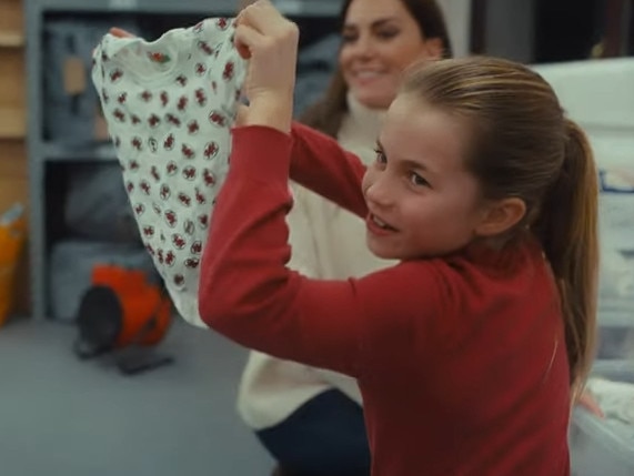 Princess Charlotte was amused by a baby bodysuit. Picture: Kensington Palace/YouTube