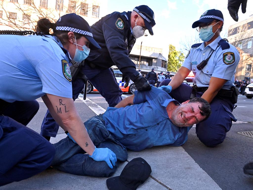 Police arrest a protester at a rally in Sydney. Picture: Steven Saphore/AFP