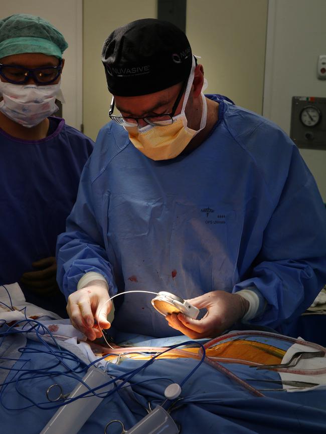 Neurosurgeon Michael Murphy placing the pump. Picture Andrew Tauber