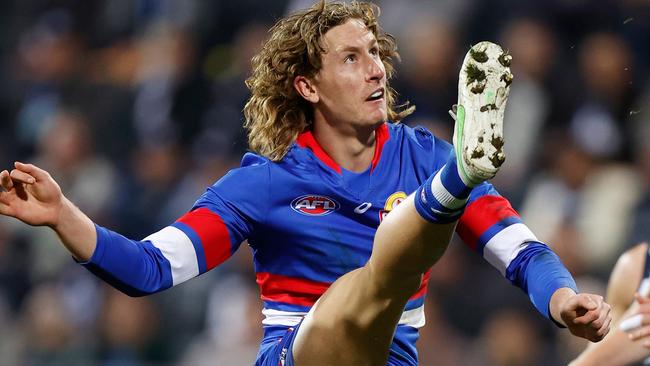 GEELONG, AUSTRALIA - JUNE 18: Aaron Naughton of the Bulldogs kicks the ball during the 2021 AFL Round 14 match between the Geelong Cats and the Western Bulldogs at GMHBA Stadium on June 18, 2021 in Geelong, Australia. (Photo by Michael Willson/AFL Photos via Getty Images)