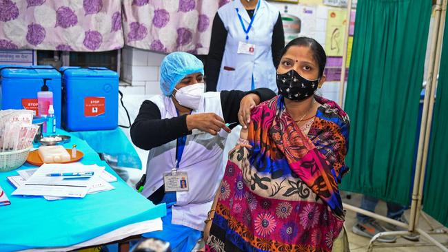 Health officials and a volunteer take part in a mock drill for COVID-19 in New Delhi on Satyrday. Picture: AFP