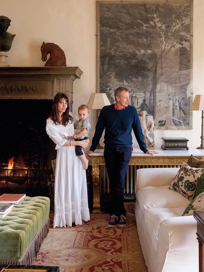 Villa Cetinale’s current owners Marina and Ned Lambton with their son Archer in one of their sumptuous rooms. Picture: Simon Upton