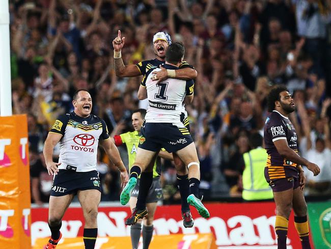 Thurston celebrates kicking the winning field in golden point to give the Cowboys the NRL premiership. Picture. Phil Hillyard