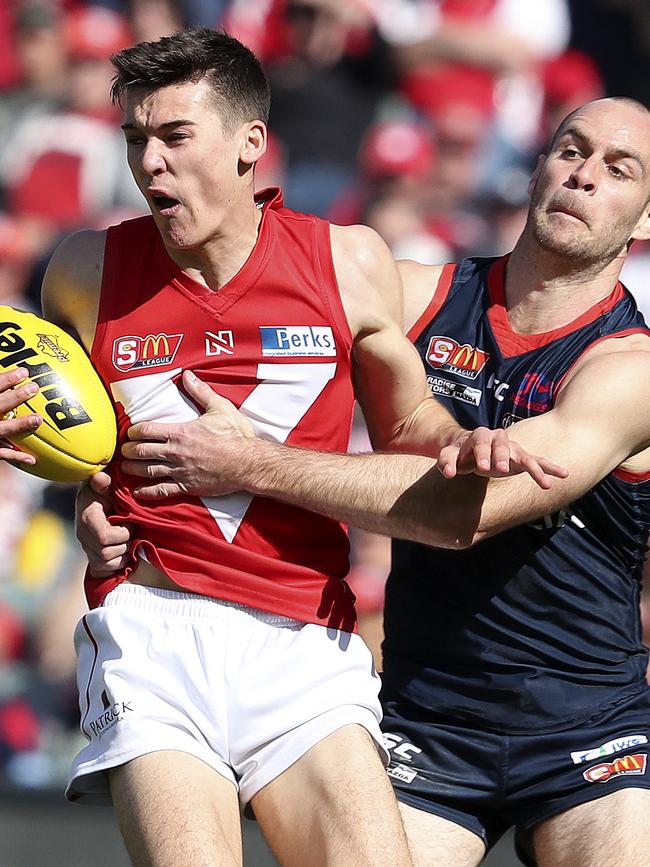 Connor Rozee takes possession ahead of Norwood skipper Jace Bode in the SANFL grand final. Picture Sarah Reed