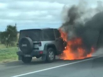 A vehicle engulfed in flames on Geelong Ring Road.