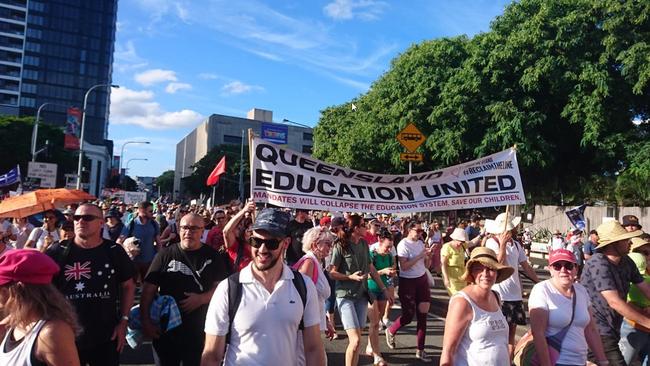 Teachers at a rally over the mandates.