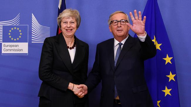 European Commission chief Jean-Claude Juncker welcomes Theresa May to Brussels. Picture: AFP