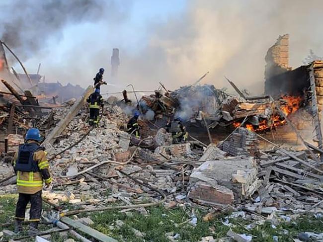 Ukrainian firefighters putting out a fire after Russian missiles hit eastern Ukraine's Lugansk region. Picture: AFP