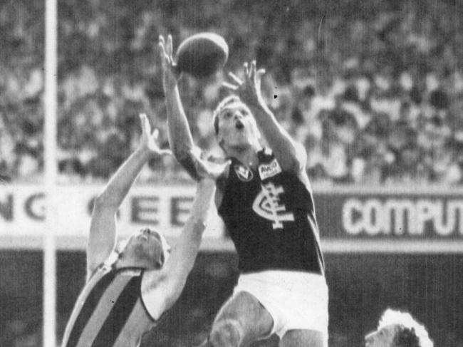 Stephen Silvagni with Dermott Brereton in the VFL Carlton vs Hawthorn Grand Final in 1987, when temperatures hit 30.7C. Picture: Ex News Melb