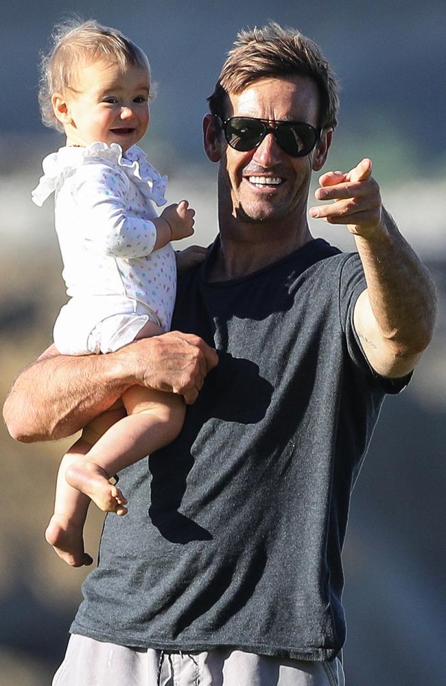 Andrew Johns enjoying the spring sunshine this week with daughter Alice. Picture: Mega