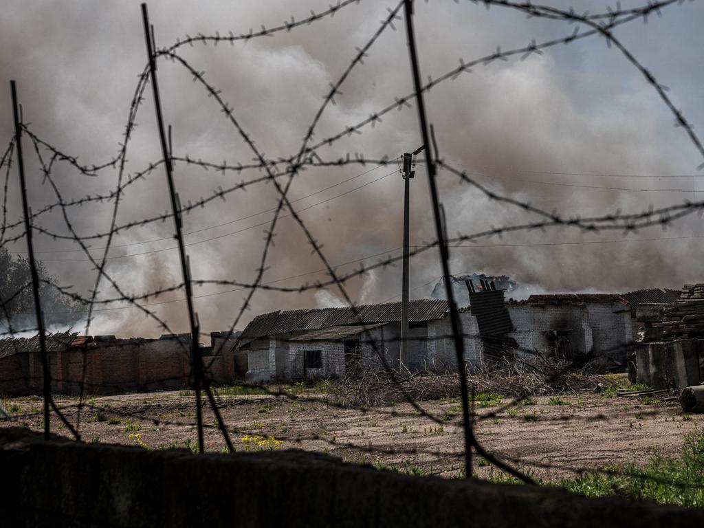 Smoke rising from a burning storage containing agricultural products after shelling by Russian forces in the town of Orikhiv, near Zaporizhzhia, eastern Ukraine. Picture: AFP.