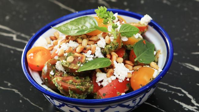 Acres Surf’s tomato salad with fetta, toasted pine nuts and salsa verde dressing.