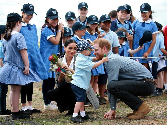 Prince Harry gets a huge from Luke Vincent, 5, in Dubbo. Picture: Toby Zerna