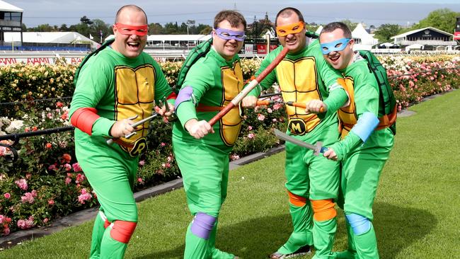 Race fans Bruce Baxter, Terrence Ravlin, Mitch Walden and Kurt Goldman dress up.