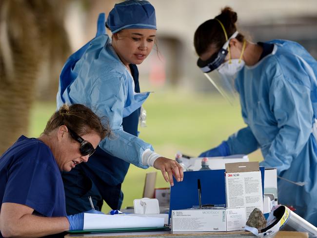 Medical professionals are seen preparing COVID-19 tests for members of the public at the Bondi Beach drive-through COVID-19 testing centre in Sydney. Picture: AAP