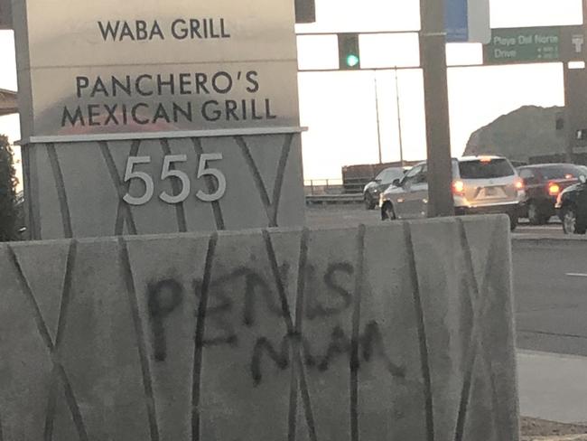 Dustin Shomer has been charged with 16 counts of graffiti after he was caught spray painting the term "Penis Man' on various buildings and objects in Tempe, Arizona. Picture: supplied