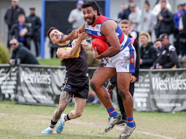 WRFL: Point Cook’s Derek Eggmolesse-Smith gives Cooper Pepi of Caroline Springs the don’t argue. Picture: George Sal