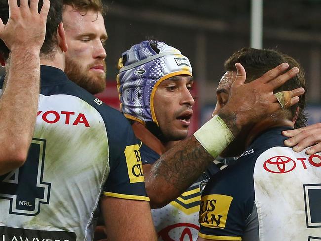 SYDNEY, AUSTRALIA - APRIL 13: Gavin Cooper and Johnathan Thurston of the Cowboys congratulate Antonio Winterstein of the Cowboys after he scoreda try during the round six NRL match between the South Sydney Rabbitohs and the North Queensland Cowboys at ANZ Stadium on April 13, 2015 in Sydney, Australia. (Photo by Mark Kolbe/Getty Images)