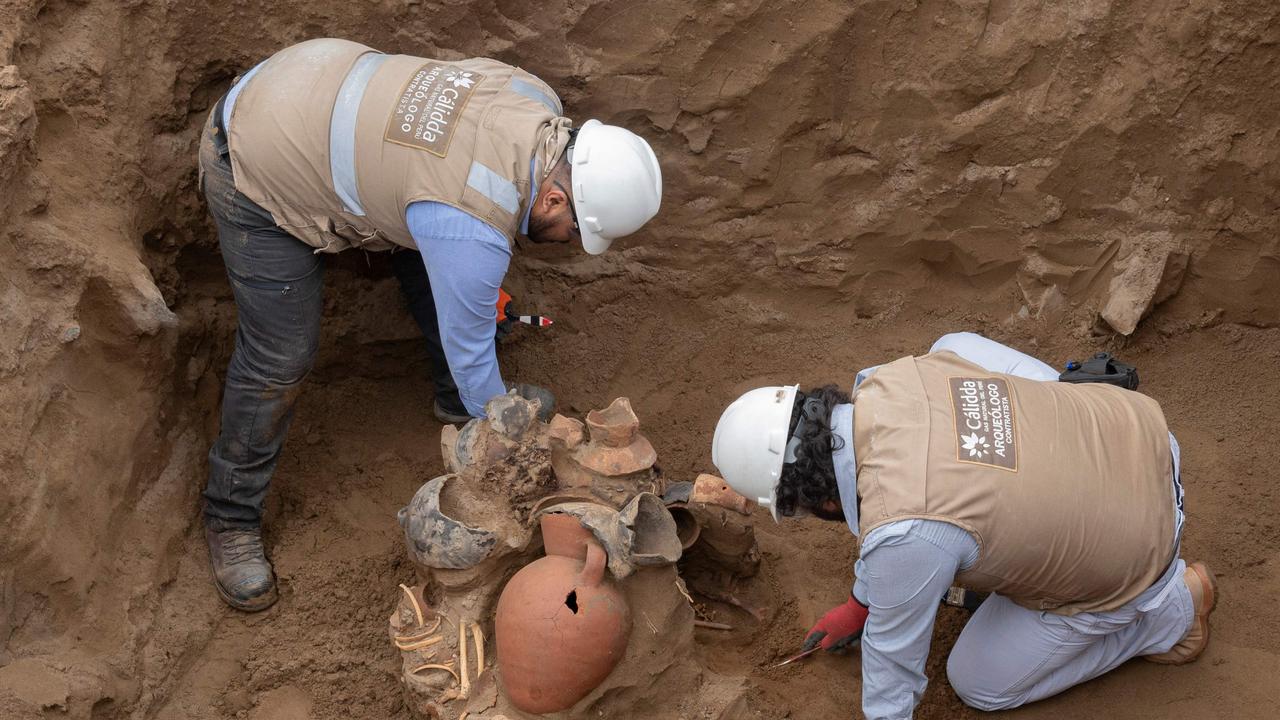 Peruvian gas workers have made an astonishing discovery beneath the ancient streets of Lima this week, uncovering eight mummies and a number of Pre-Inca artifacts. Picture: Cris Bouroncle / AFP