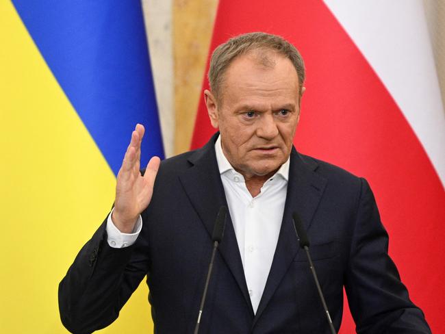 Poland's Prime Minister Donald Tusk gestures as he delivers a joint press conference with Ukraine's President in Lviv, on December 17, 2024, amid the Russian invasion of Ukraine. (Photo by YURIY DYACHYSHYN / AFP)