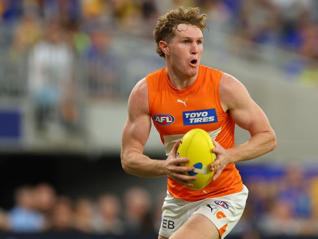 Tom Green of the Giants looks for options as he runs down the field during the round two AFL match between West Coast Eagles and Greater Western Sydney Giants. Picture: James Worsfold/AFL Photos/via Getty Images.