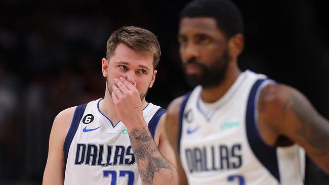 ATLANTA, GEORGIA - APRIL 02: Luka Doncic #77 and Kyrie Irving #2 of the Dallas Mavericks react against the Atlanta Hawks during the second quarter at State Farm Arena on April 02, 2023 in Atlanta, Georgia. NOTE TO USER: User expressly acknowledges and agrees that, by downloading and or using this photograph, User is consenting to the terms and conditions of the Getty Images License Agreement.   Kevin C. Cox/Getty Images/AFP (Photo by Kevin C. Cox / GETTY IMAGES NORTH AMERICA / Getty Images via AFP)
